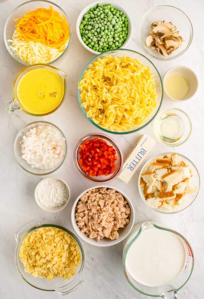 all of the ingredients for tuna noodle laid out in different bowls