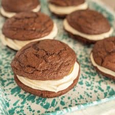 close up side view of whoopie pies on a tray