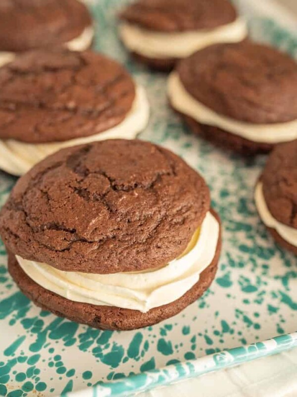 close up side view of whoopie pies on a tray