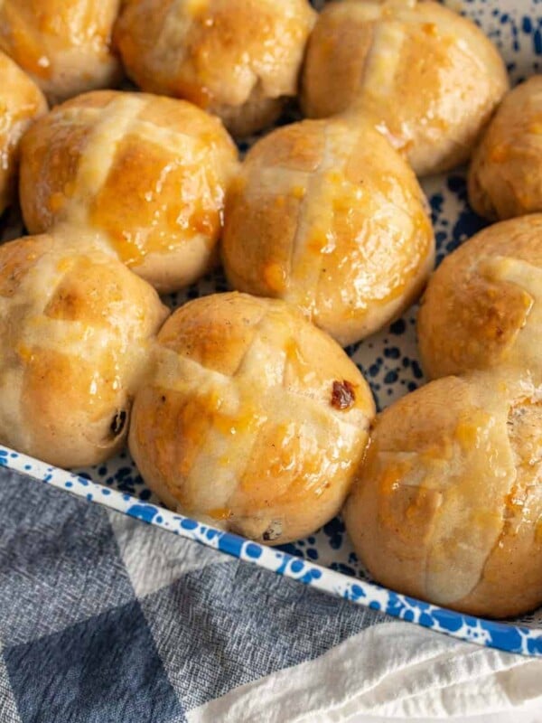 close up of hot cross buns in a baking dish