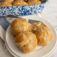 hot cross buns on a white plate