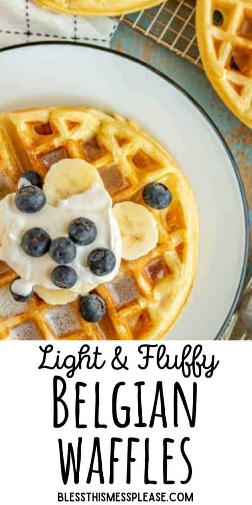 Top view of a waffle on a plate, topped with blueberries, banana slices, and whipped cream, with the words "light and fluffy Belgian waffles" written at the bottom