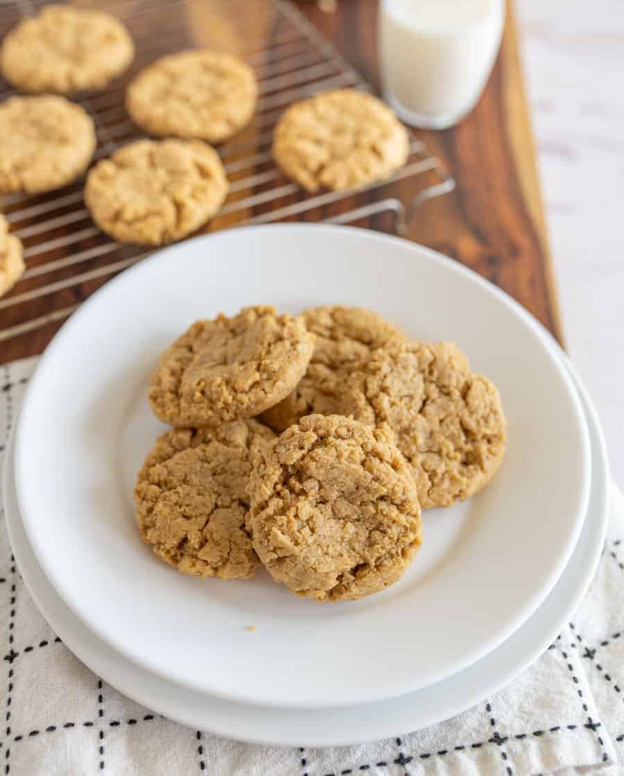 white plate full of oatmeal cookies with peanut butter.