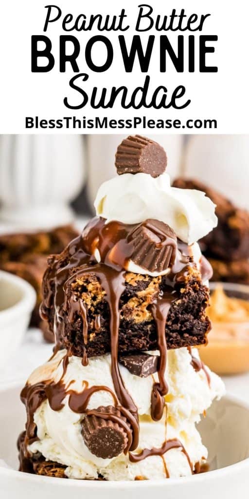 peanut butter brownie ice cream sundae with hot fudge, whipped cream, and peanut butter cups in a bowl with the words "peanut butter brownie sundae" written at the top