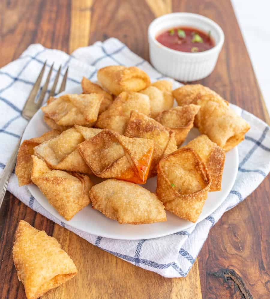 plate full of cream cheese wontons.