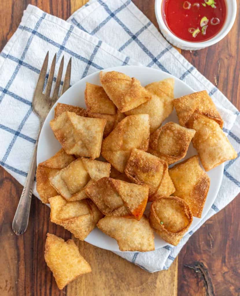 top view of a plate full of cream cheese wontons