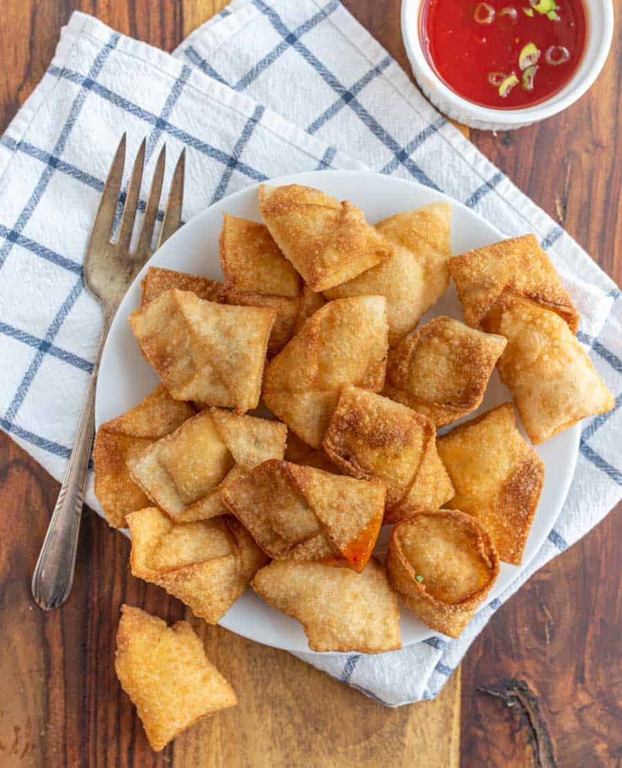 top view of a plate full of cream cheese wontons.