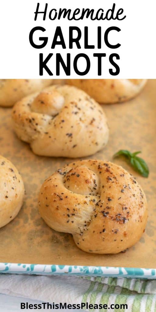 garlic knots on a baking sheet with the words "homemade garlic knots" written at the top