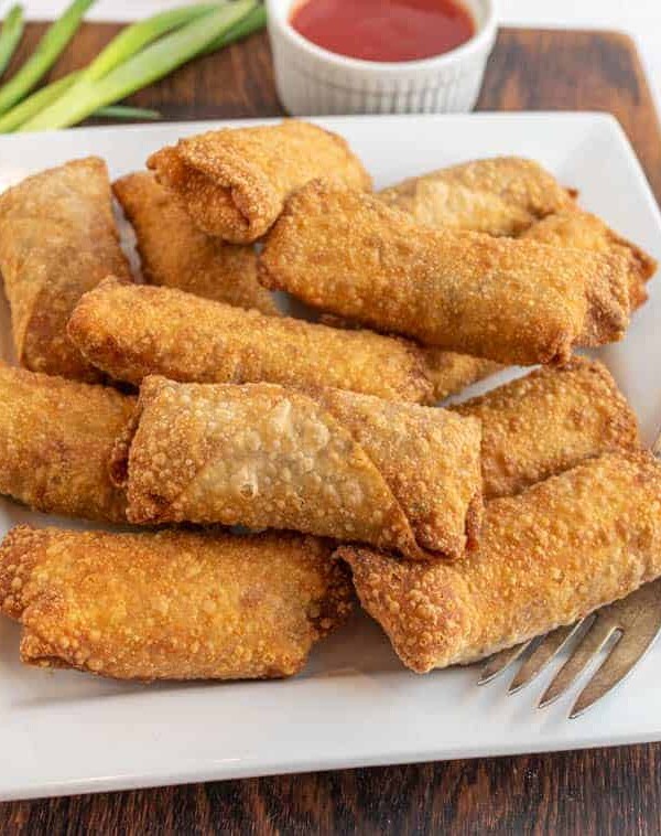 close up of a plate of egg rolls