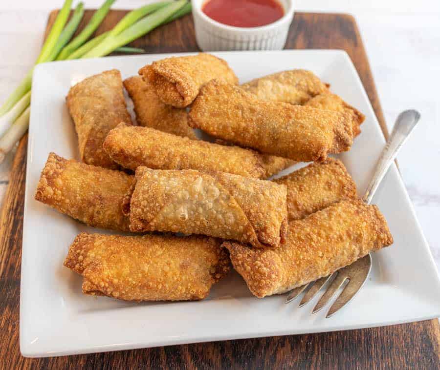 close up of a plate of egg rolls