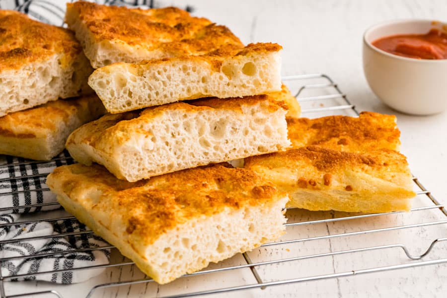 close up of slices of focaccia bread stacked on each other