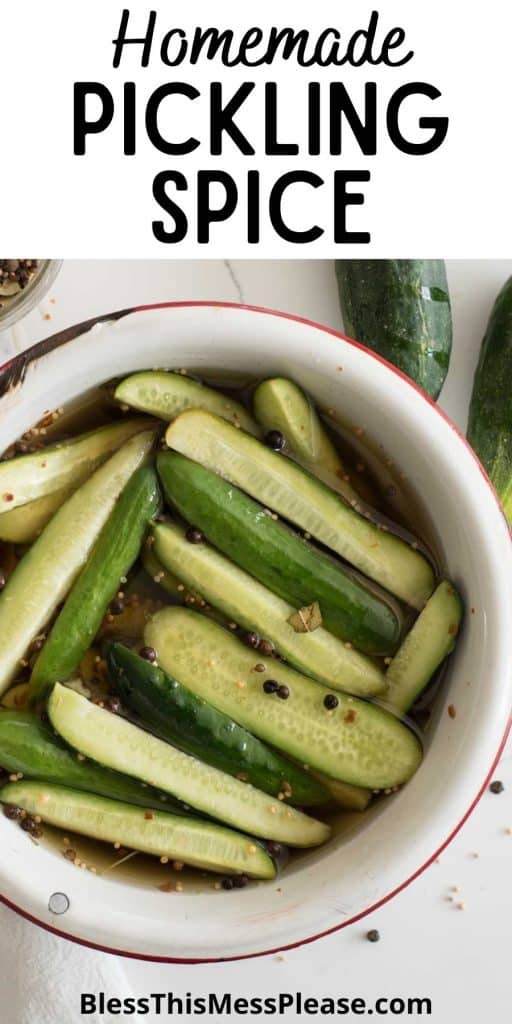 top view of a bowl of cucumbers in vinegar with pickling spice and the words "homemade pickling spice" written at the top