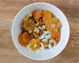 top view of ingredients for trail mix in a bowl