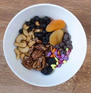 top view of ingredients for trail mix in a bowl