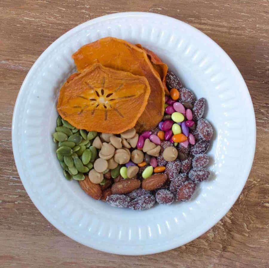 top view of ingredients for trail mix in a bowl