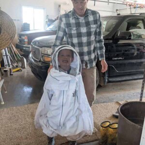 child in an adult bee suit