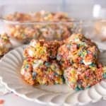 close up picture of fruity pebble treats on a plate