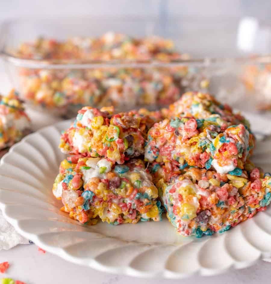 close up picture of fruity pebble treats on a plate