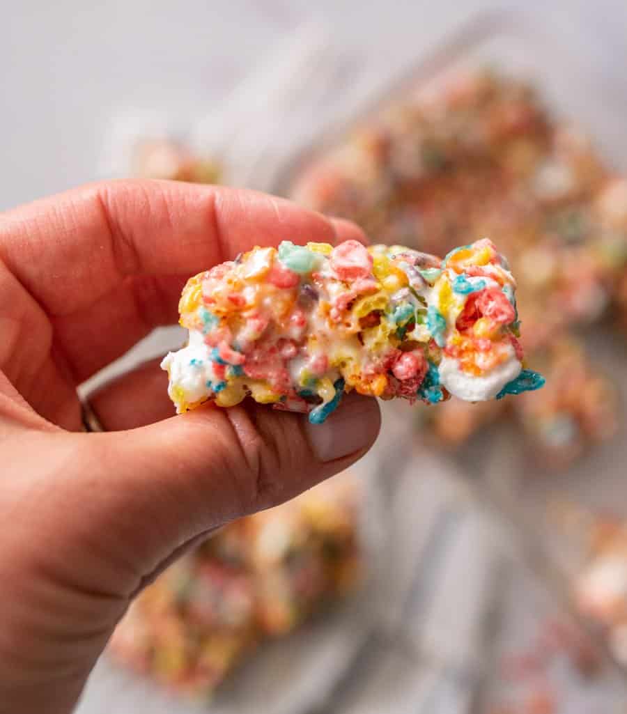 hand holding a fruity pebble treat