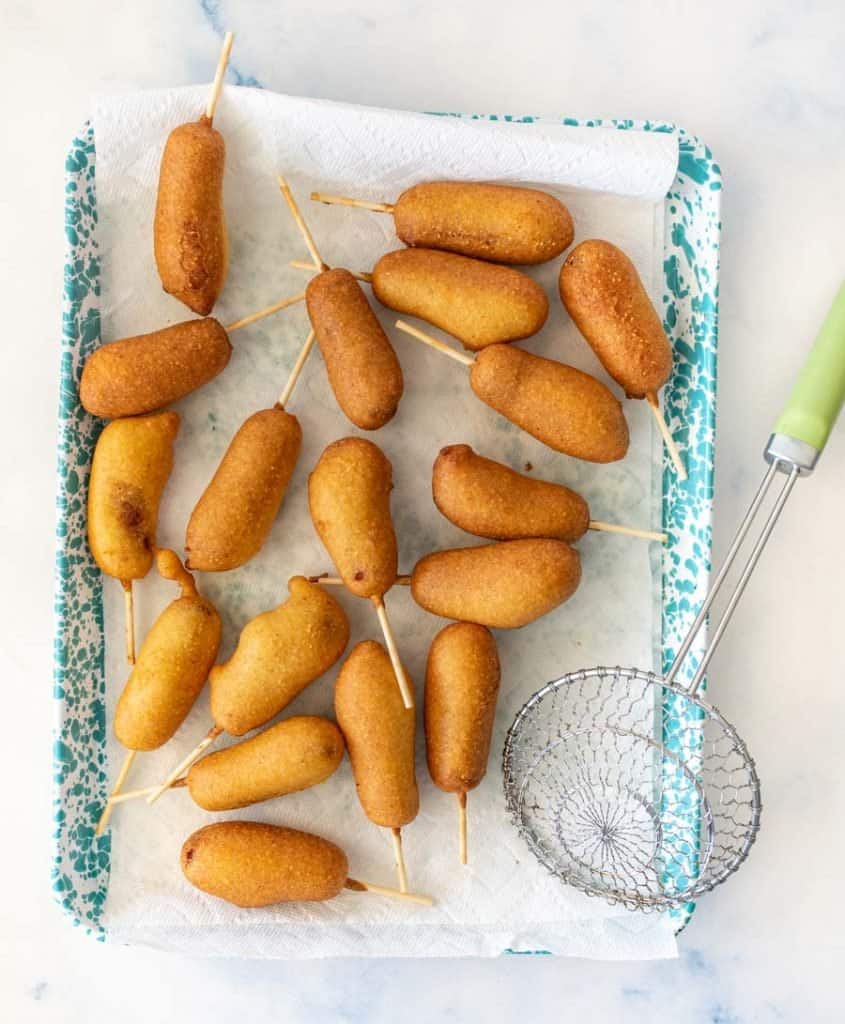 top view of corndogs on a tray lined with paper towel