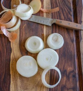 onions being sliced into rings.