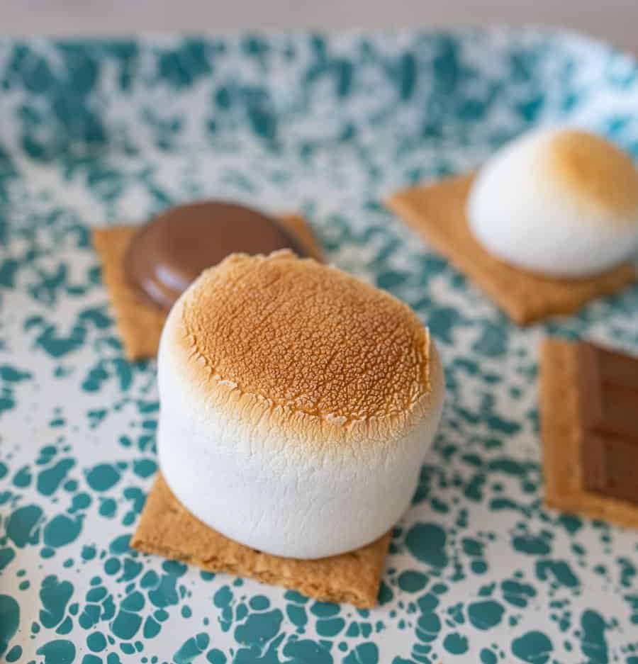 close up of toasted marshmallow on a graham cracker