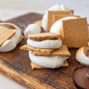 smores on a cutting board, stacked on top of each other