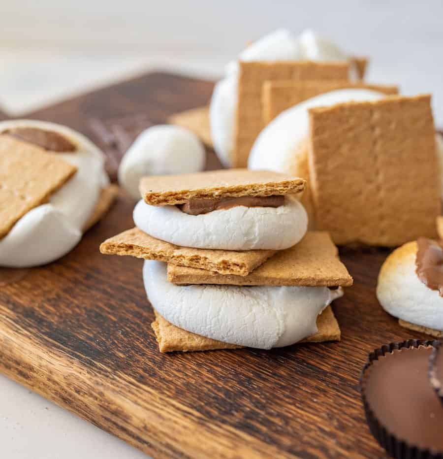 smores on a cutting board, stacked on top of each other