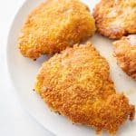 close up parmesan crusted chicken on a plate
