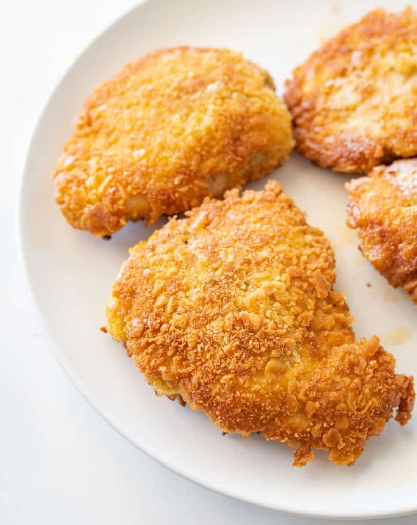 close up parmesan crusted chicken on a plate