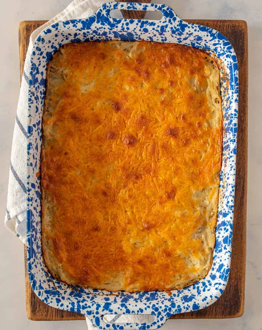 top view of cheesy potato casserole in a baking dish