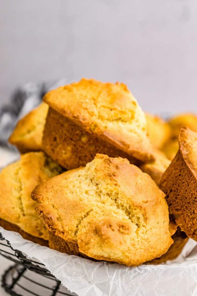Cornbread muffins stacked in a plate.