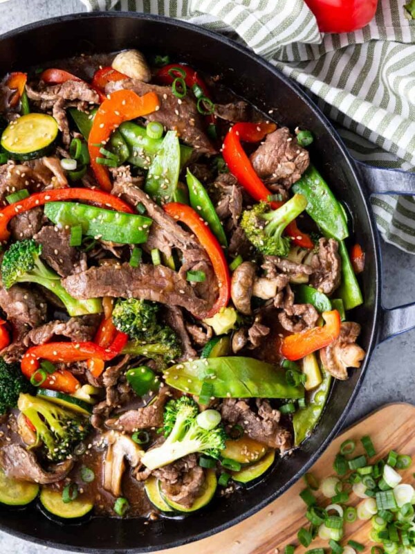 top view of teriyaki beef and vegetables in a cast iron skillet