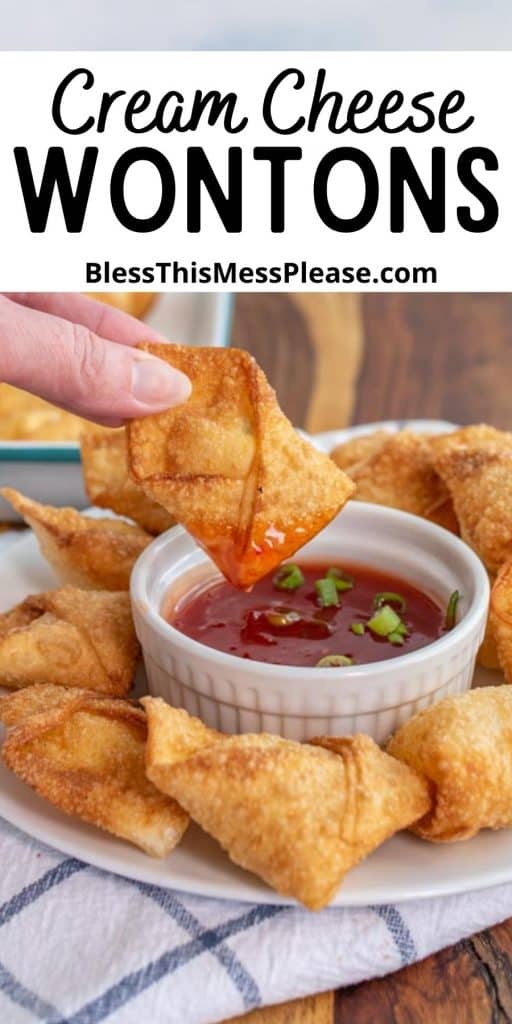 cream cheese wonton being dipped into sauce with the words "Cream cheese wontons" written at the top