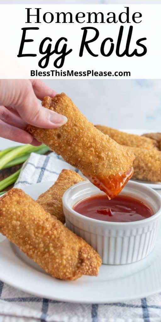 hand dipping egg roll in sauce with the words "homemade egg rolls" written at the top