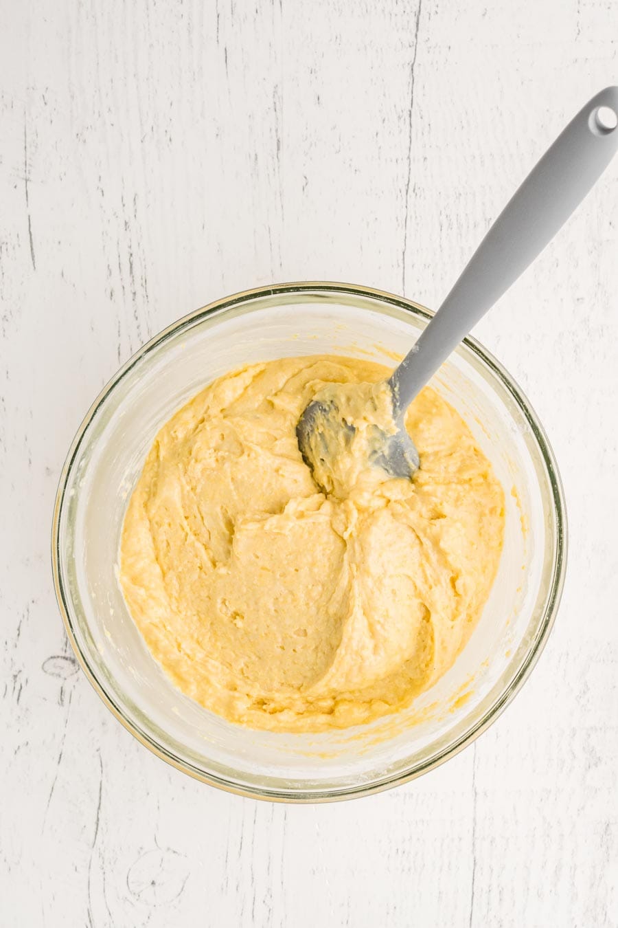 homemade cornbread muffin batter ready to go in the tin.