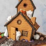 picture of a haunted gingerbread house with marshmallow ghosts