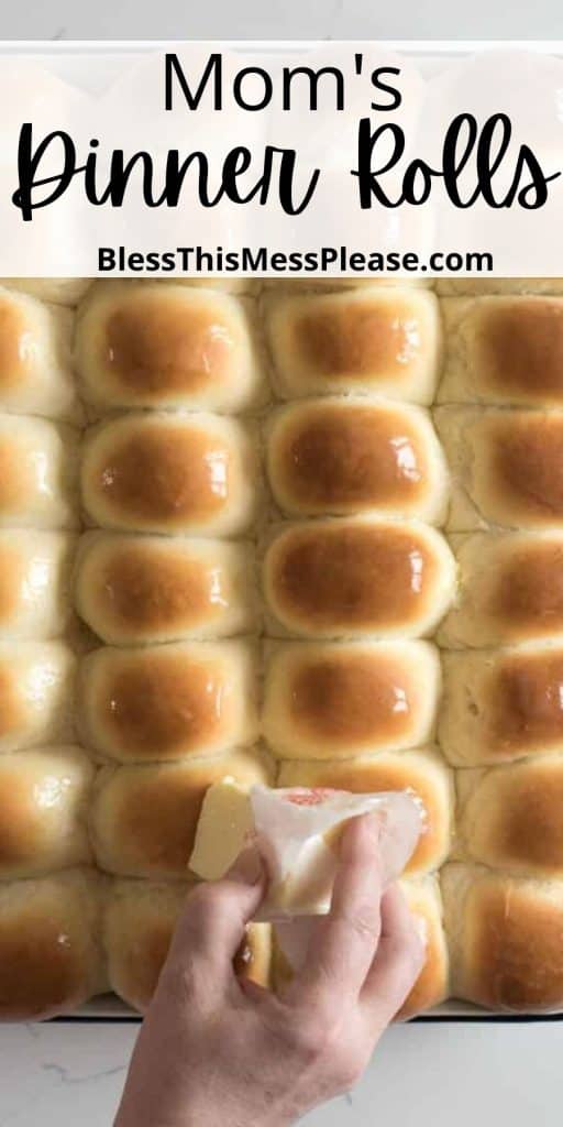 pinterest pin with text that reads "moms jumbo dinner rolls" - image of buttery topped baked rolls still in the sheet pan