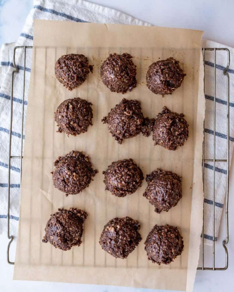 These no-bake chocolate coconut cookies will satisfy your sweet tooth & are kid approved too! Made with a winning combo of cocoa, coconut & peanut butter. #coconute #healthycookies #nobake #nobakecookie