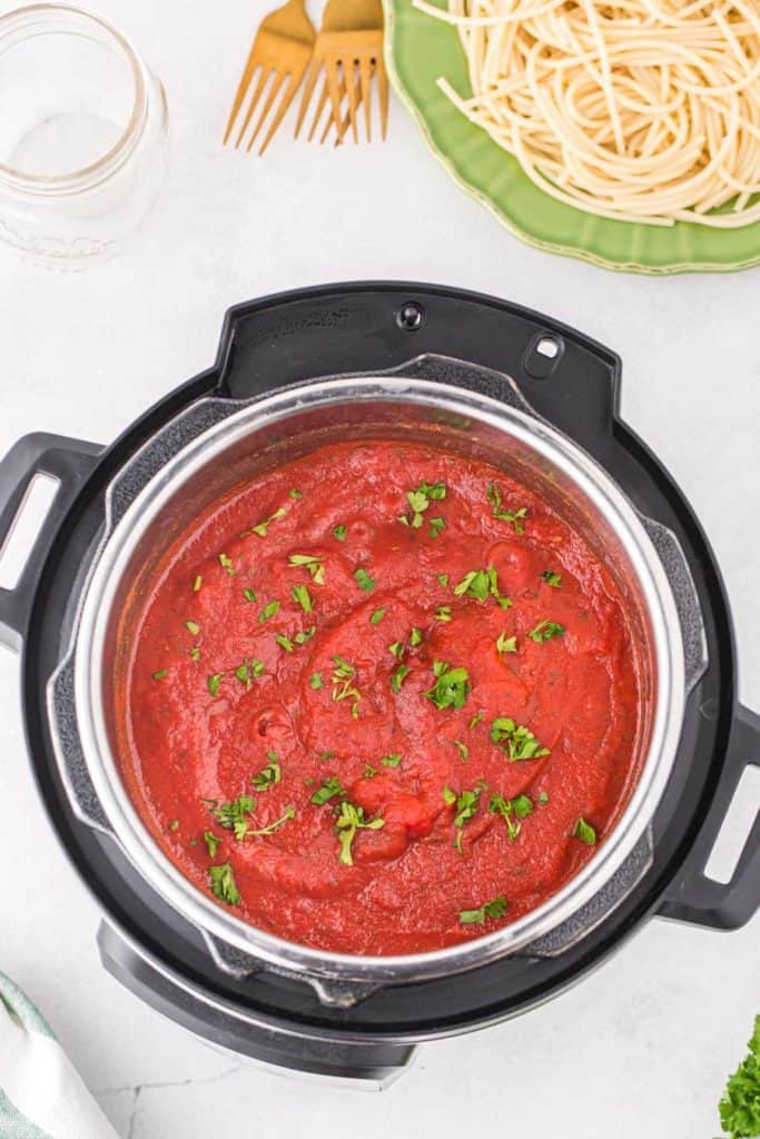 top view of instant pot with red spaghetti sauce