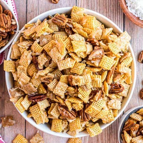 top view white bowl of festive chex-mix