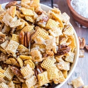 top view white bowl of festiverecipe for sweet chex mix.