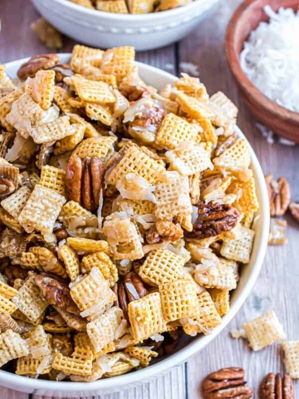 top view white bowl of festiverecipe for sweet chex mix.