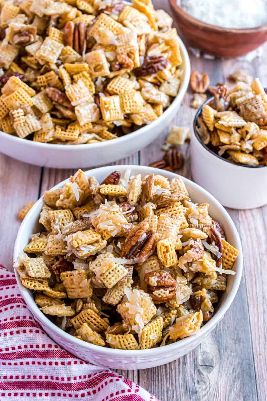 finished sticky chex mix in white bowl.