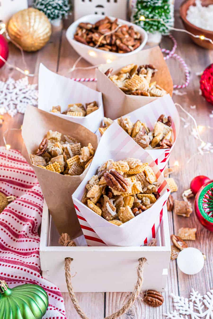 chex mix in cute holiday paper cones ready to serve.