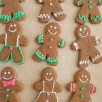 top view of traditionally decorated holiday ginger-people cookies on a sheet pan