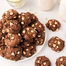 chocolate cookies with white chips piled on a plate