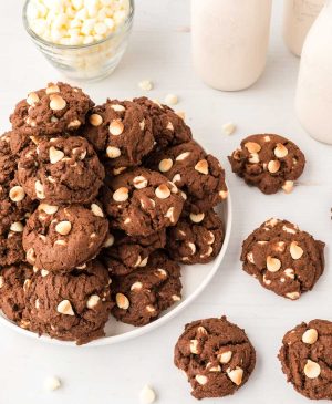 chocolate cookies with white chips piled on a plate