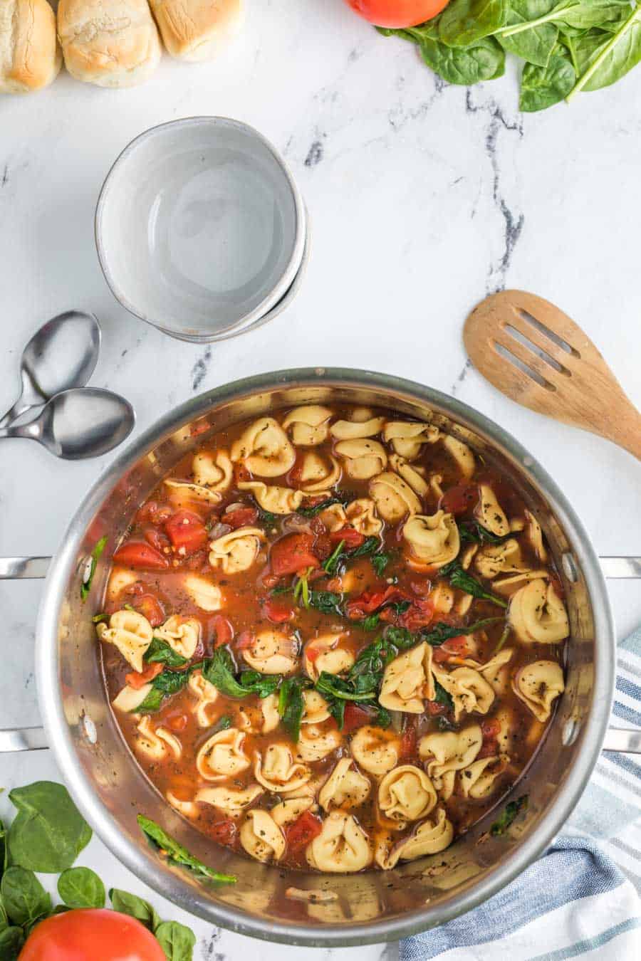 top view of the completed tortellini soup with tomatoes and spinach