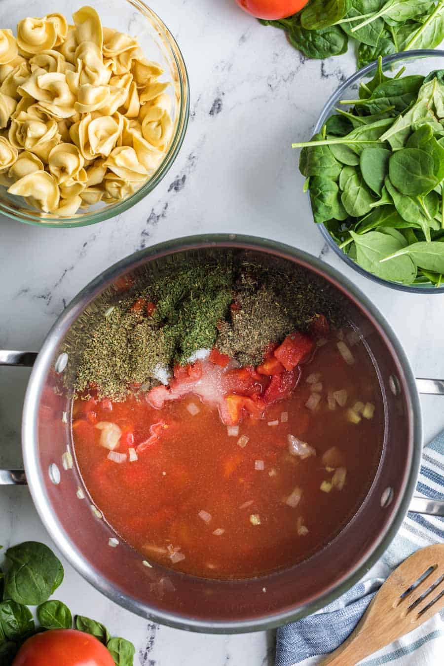 top view pot with soup stock and spices in side